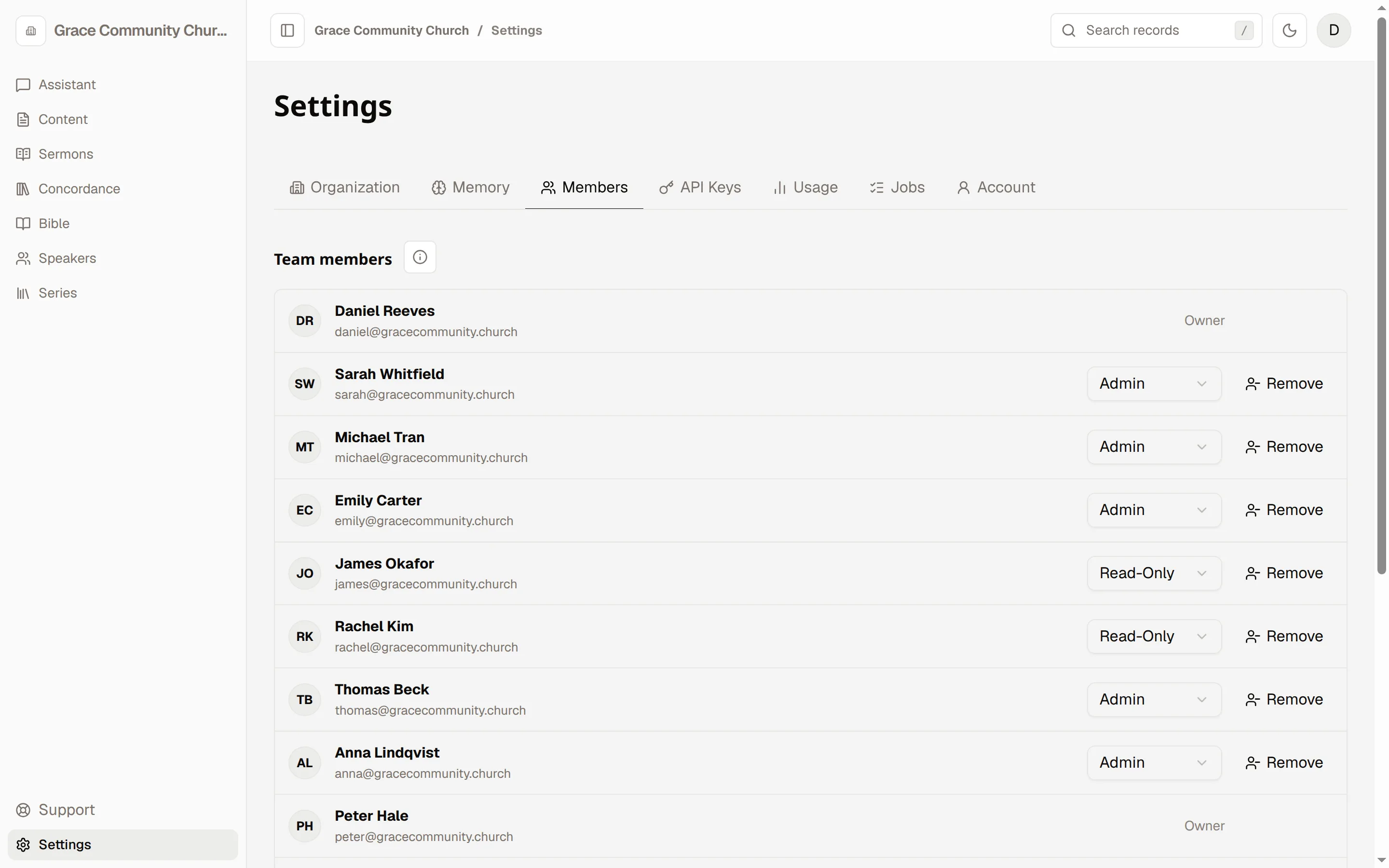Settings, Members: a list of team members with a role picker beside each one.